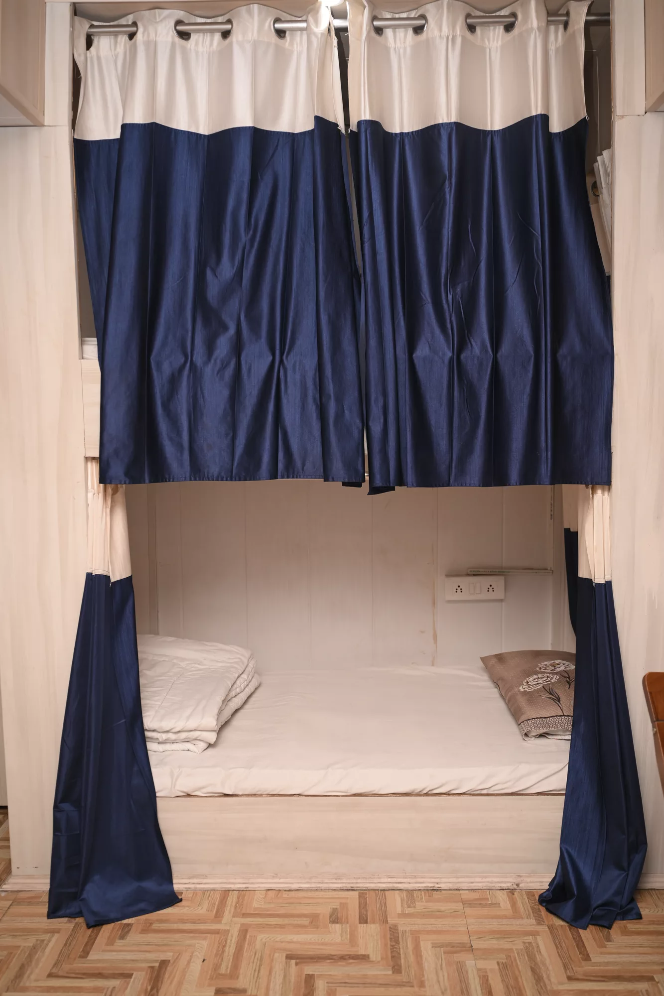 Dorm bunk bed with privacy curtain at Anpadh Cafe & Hostel, Rishikesh